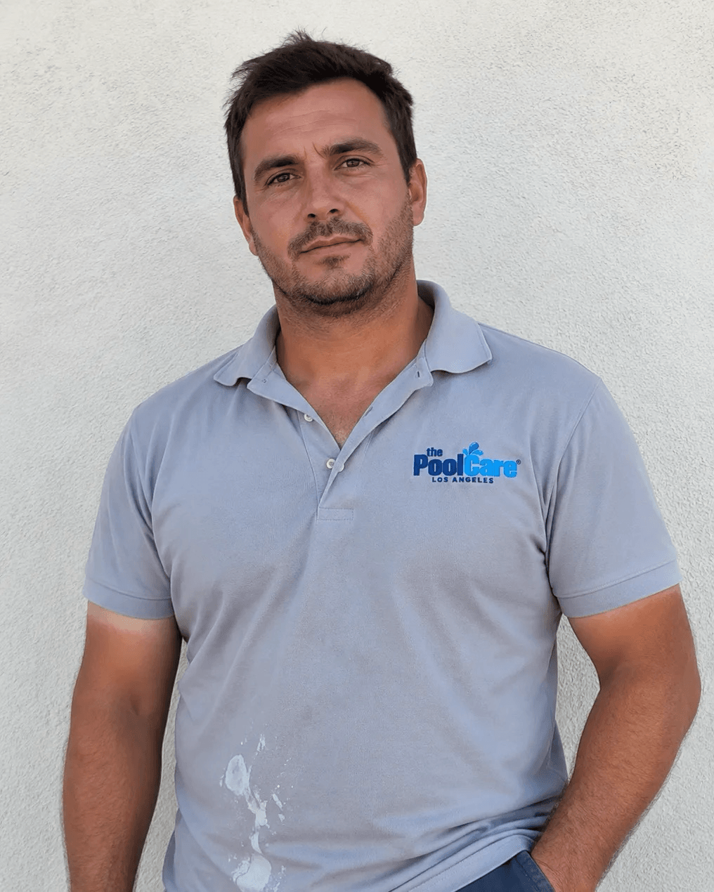 A Pool Care LA route technician in a branded polo